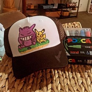 Hand drawn Gengar & Pikachu, with acrylic paint, on a adjustable trucker cap.